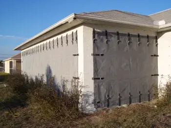 EZMax hurricane screen strapped over garage doors and entryways